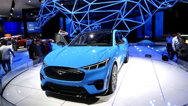 People visit Ford’s all-electric SUV Mustang Mach-E at the 2019 Los Angeles Auto Show in Los Angeles, the United States, Nov. 22, 2019.