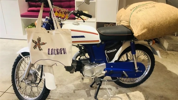 Vietnam's Lacaph decorates its coffeeshop with an iconic motorbike toting a bag of beans. Photo by Lien Hoang.