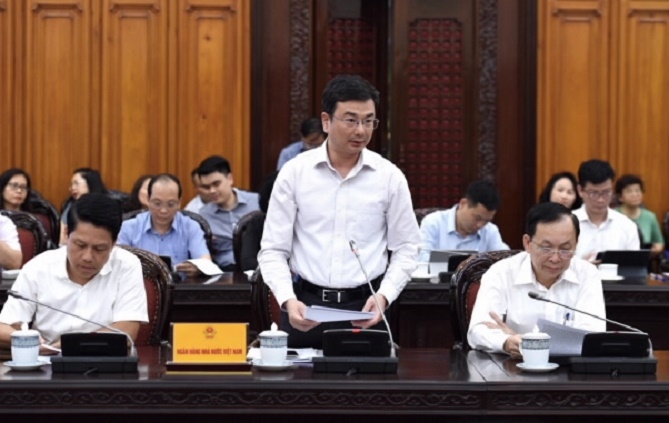 Phó Thống đốc Ngân hàng Nhà nước Phạm Thanh Hà báo cáo tại cuộc họp. Ảnh: NHNN